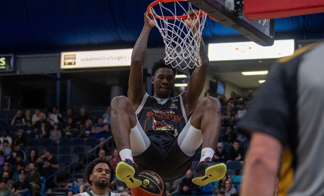 A photo of a Vancouver Bandits player dunking the basketball